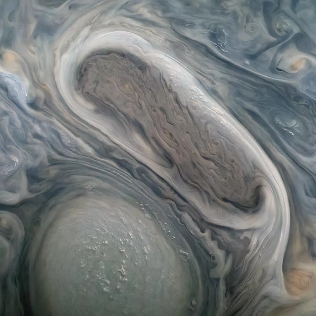 NASA/JunoCam image of Jupiter’s giant storms with bright high clouds casting shadows.